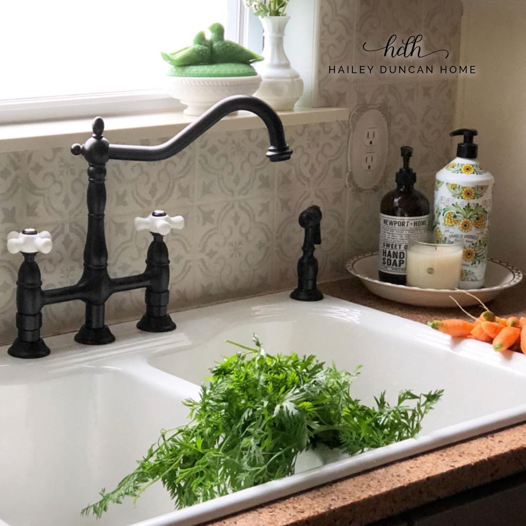 Farmhouse Sink with painted and stenciled tile backsplash