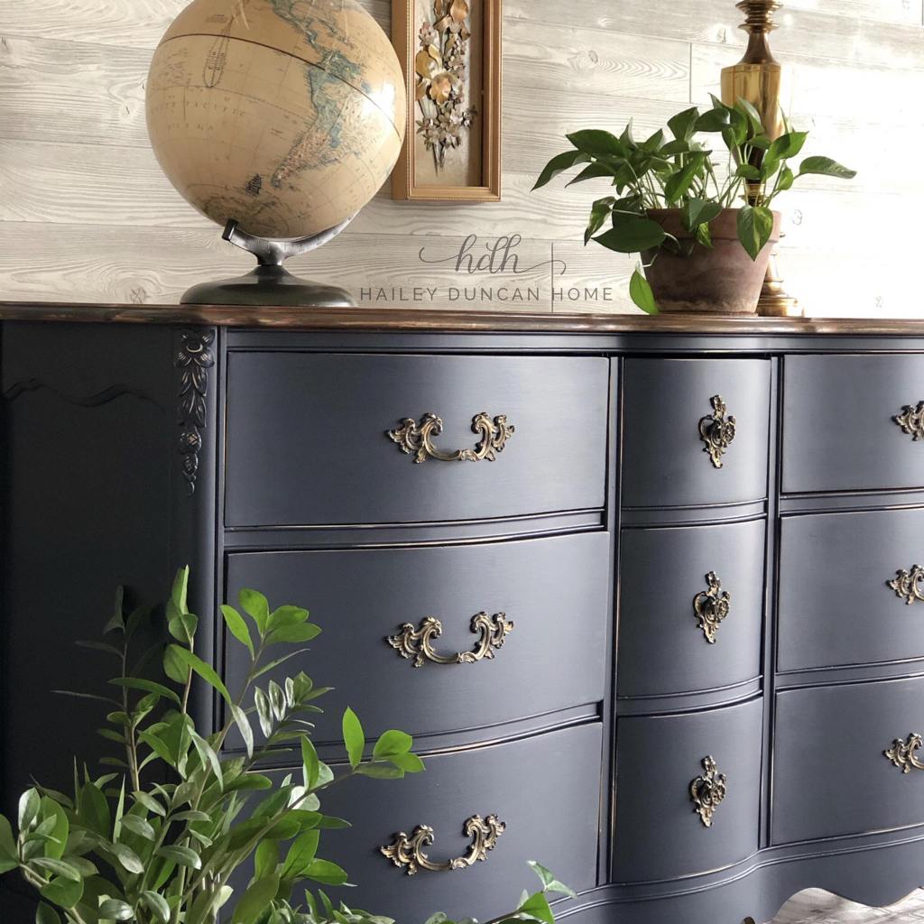 Dresser Makeover in Coastal Blue paint by General Finishes with a stained top and the original hardware.