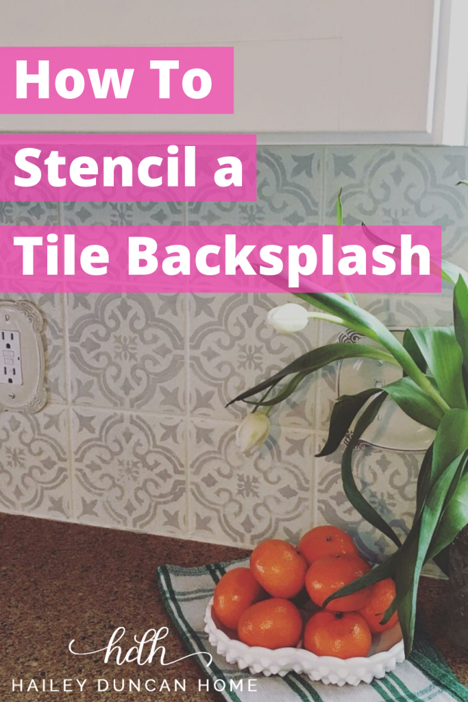 White kitchen backsplash with gray stencil over. How to Stencil a Tile Backsplash text overlay from Hailey Duncan Home.