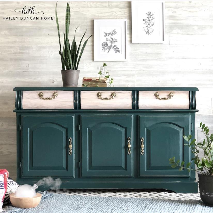 Dark green buffet with drawers left a natural wood color and gold hardware.