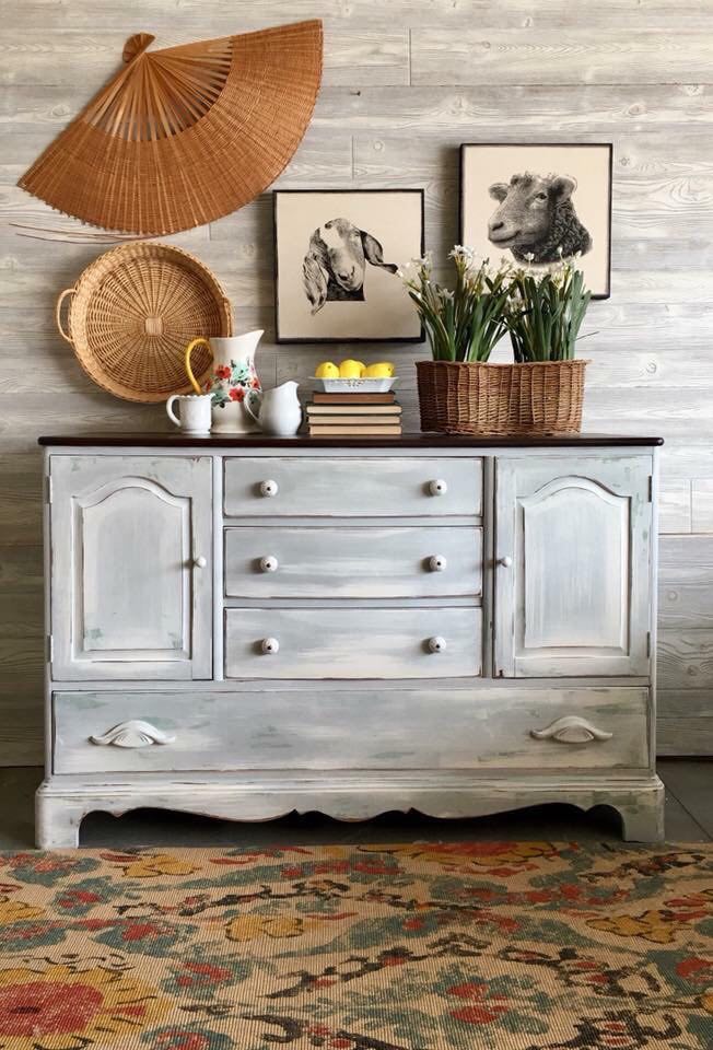 Farmhouse style painted buffet with a distressed white paint and stained top. 