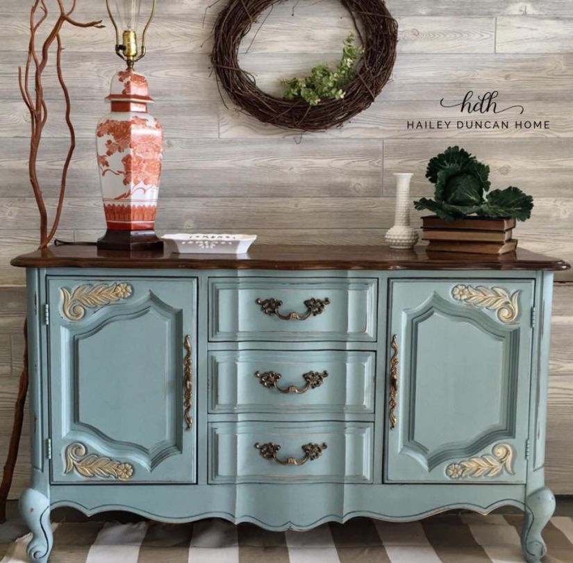 Light teal painted buffet with a stained top.